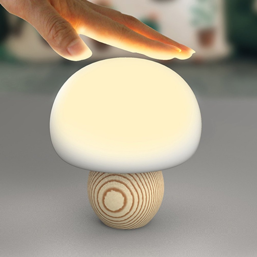 Mini lampe magnétique en forme de champignon avec capteur tactile USB. Bonne qualité et à la mode sur une table.