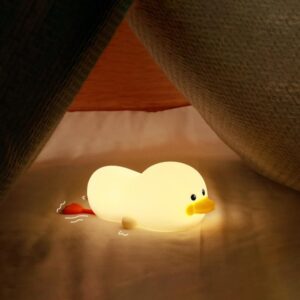 Petite veilleuse poussin allongé. Bonne qualité et à la mode