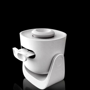 Un projecteur blanc orienté vers le haut, sur le fond noir.